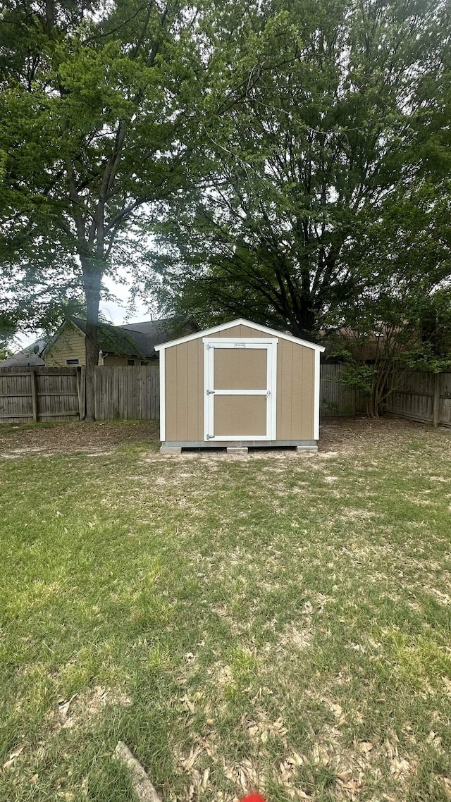 view of shed with a fenced backyard