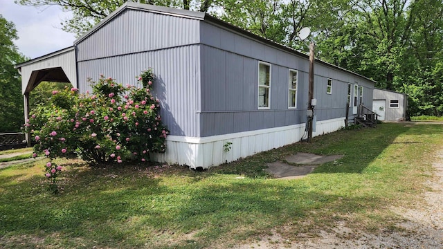 56 Central Curve Rd, Ripley, TN 38063 - view of side of property featuring a yard