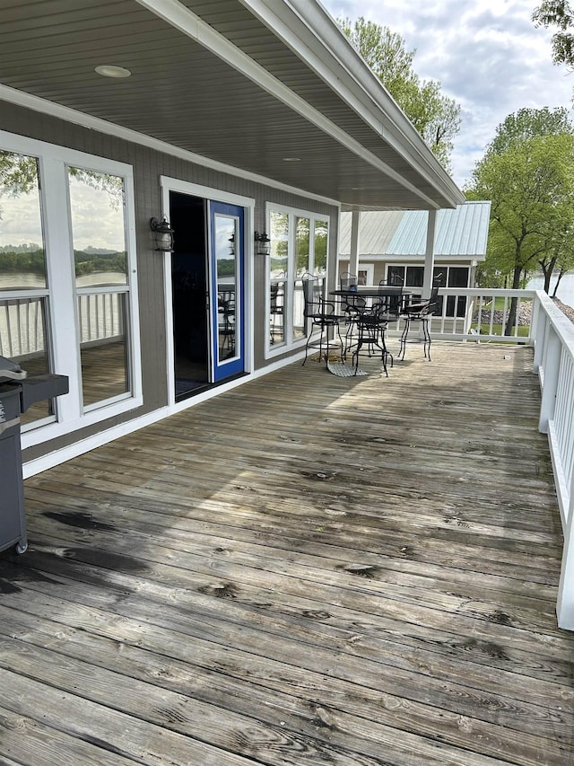 deck featuring outdoor dining area