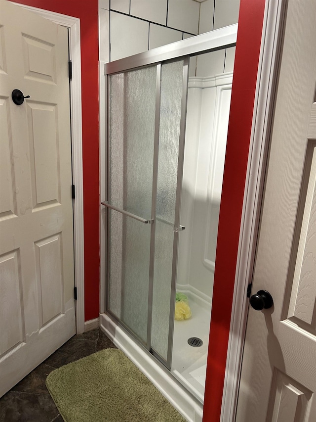 bathroom featuring a shower stall