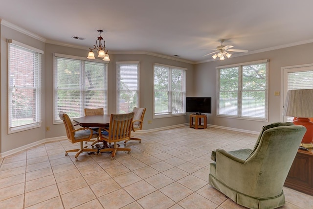 dining room featuring light tile patterned flooring, visible vents, and plenty of natural light