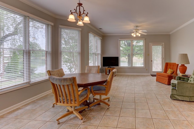 dining area featuring light tile patterned floors, ornamental molding, and a healthy amount of sunlight