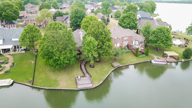 drone / aerial view featuring a water view and a residential view