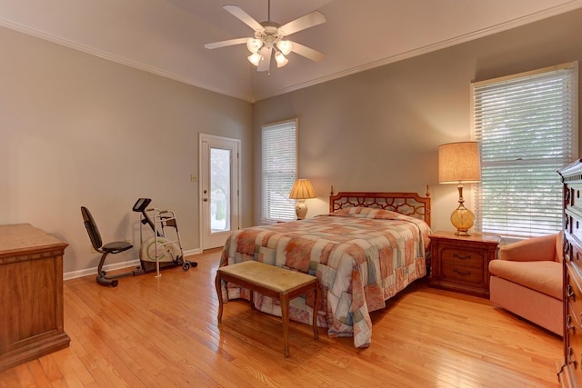 bedroom featuring light wood-style flooring, access to exterior, and multiple windows