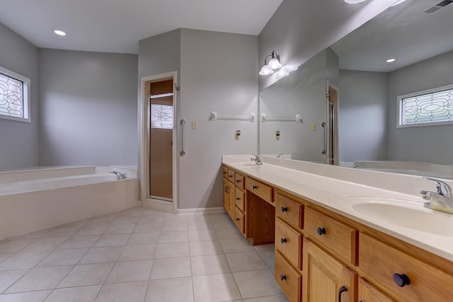 full bath featuring a shower stall, a sink, double vanity, visible vents, and a garden tub