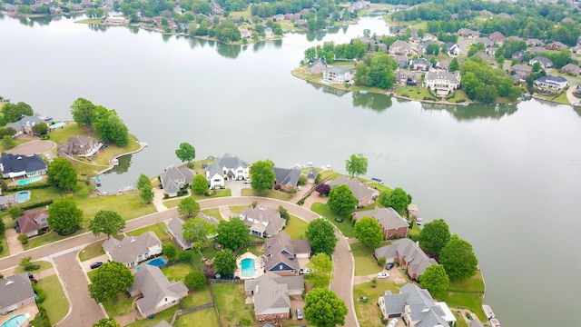 birds eye view of property with a residential view and a water view