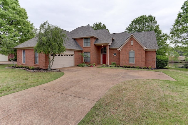 view of front of house with concrete driveway, roof with shingles, an attached garage, and brick siding