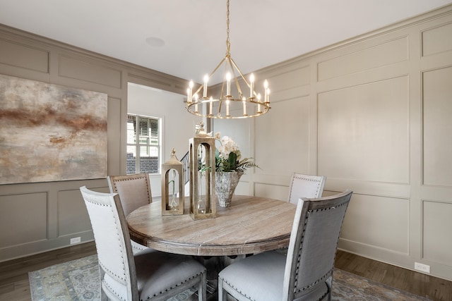 515 Saunders Creek Cir, Rossville, TN 38066 - dining area with a chandelier, dark wood-type flooring, and a decorative wall
