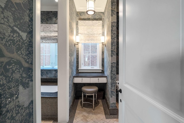 bathroom featuring wallpapered walls
