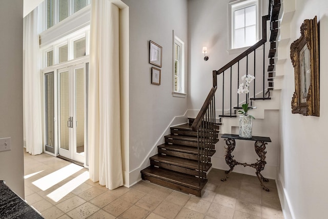 staircase featuring baseboards