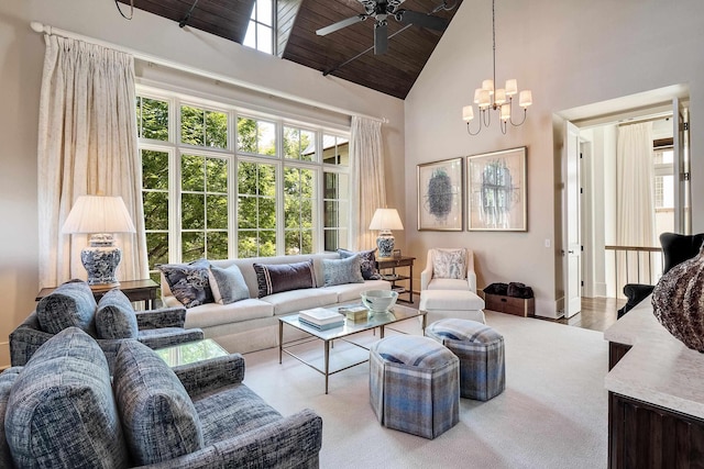 living room with ceiling fan with notable chandelier, high vaulted ceiling, wooden ceiling, and a healthy amount of sunlight