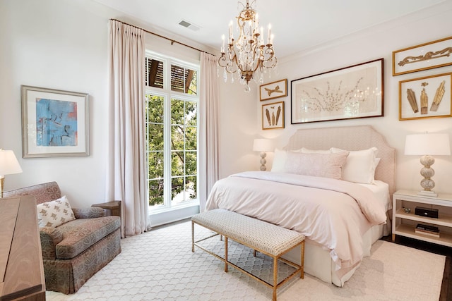 carpeted bedroom featuring a notable chandelier, multiple windows, and visible vents