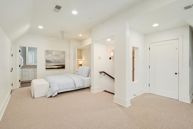 bedroom with visible vents, light carpet, connected bathroom, and recessed lighting