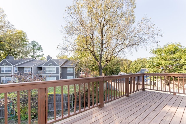 wooden terrace with a residential view