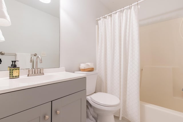 bathroom featuring shower / bath combination with curtain, toilet, and vanity