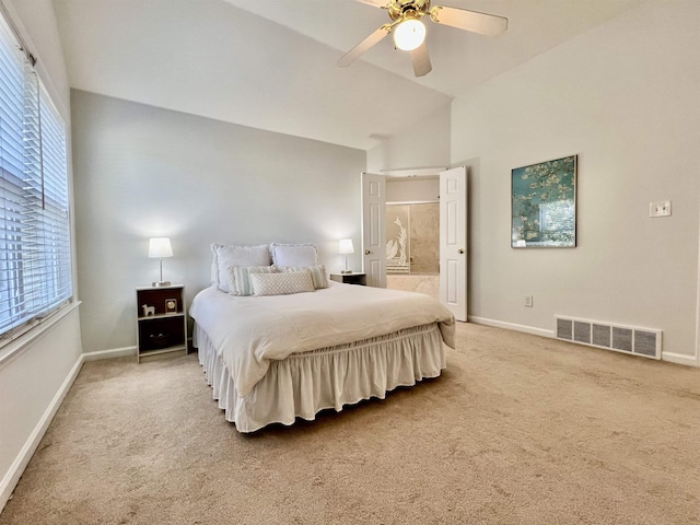 bedroom with lofted ceiling, multiple windows, visible vents, and carpet floors