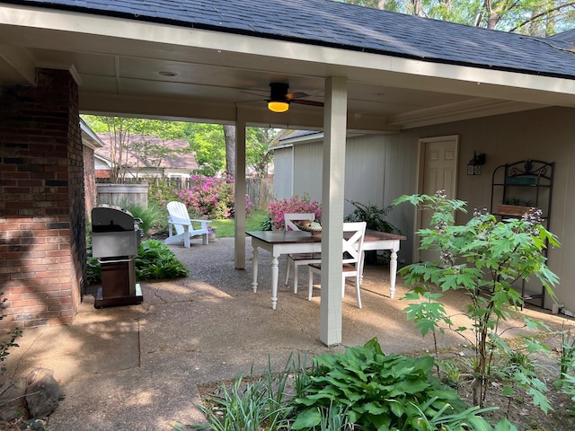 view of patio featuring fence, ceiling fan, and area for grilling