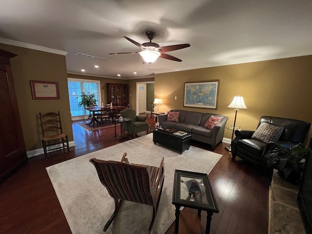 living area with crown molding, ceiling fan, dark wood-style floors, and baseboards