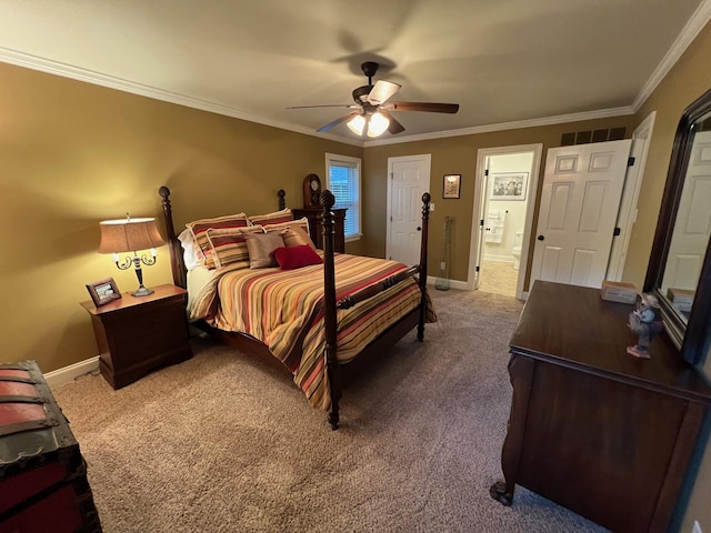carpeted bedroom featuring crown molding, connected bathroom, ceiling fan, baseboards, and visible vents