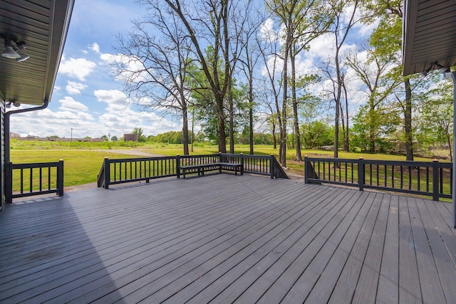 wooden deck featuring a yard