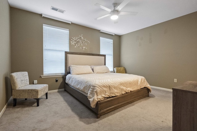 bedroom with carpet, visible vents, and baseboards