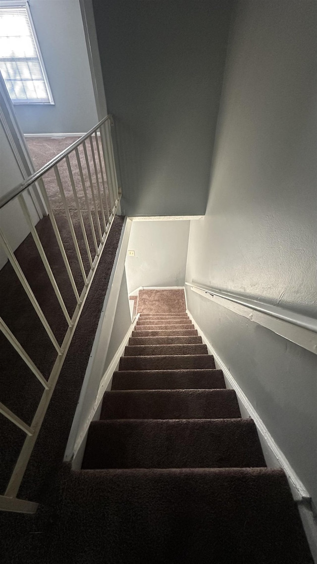 stairs featuring baseboards