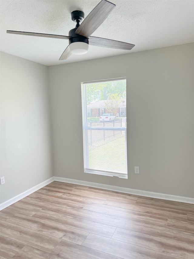 6330 Martinwest Dr, Millington, TN 38053 - empty room with light wood-type flooring, a ceiling fan, and a textured ceiling