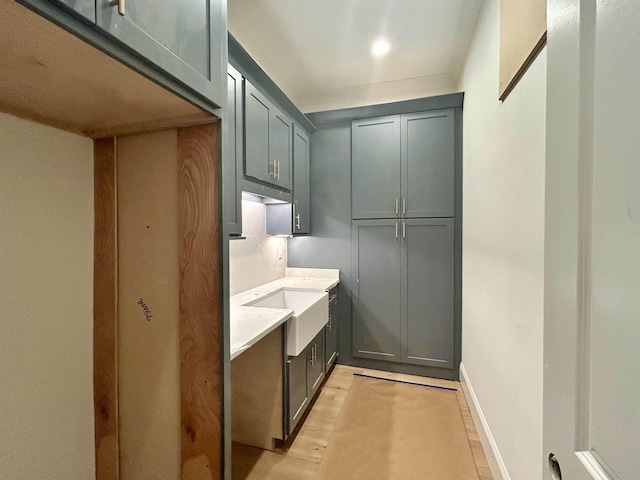 interior space featuring baseboards, light wood-type flooring, and recessed lighting