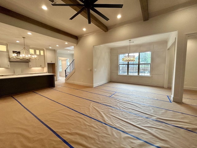 unfurnished living room with recessed lighting, beamed ceiling, ceiling fan with notable chandelier, baseboards, and stairway