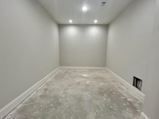 interior space with baseboards, visible vents, concrete flooring, and recessed lighting