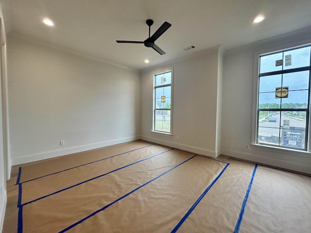 interior space featuring recessed lighting, ceiling fan, crown molding, visible vents, and baseboards
