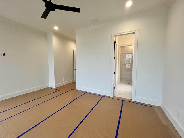 unfurnished bedroom with baseboards, recessed lighting, crown molding, and ensuite bathroom