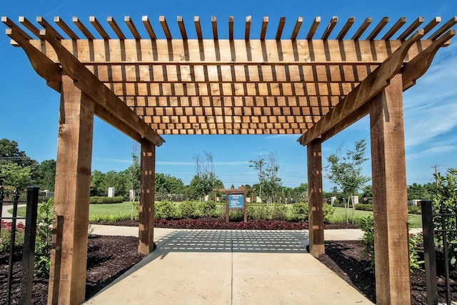 view of patio featuring fence and a pergola