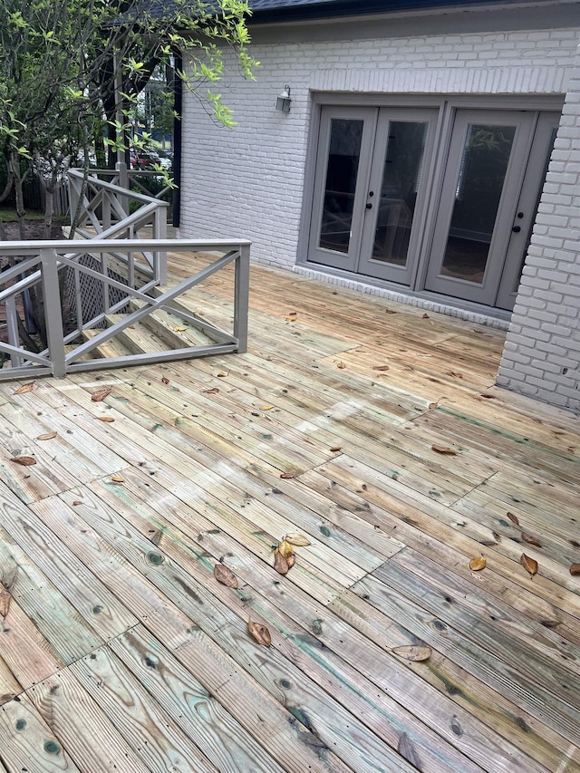 wooden deck featuring french doors