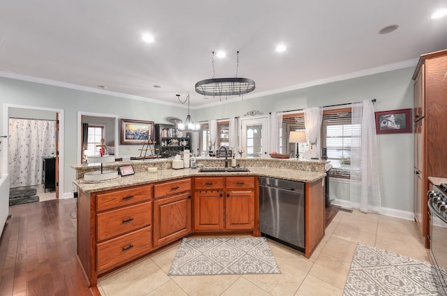 kitchen with light stone countertops, ornamental molding, dishwasher, and a sink