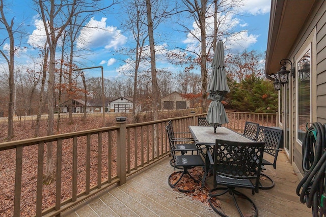 wooden deck featuring outdoor dining space