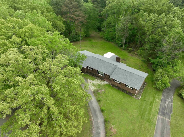 bird's eye view featuring a forest view