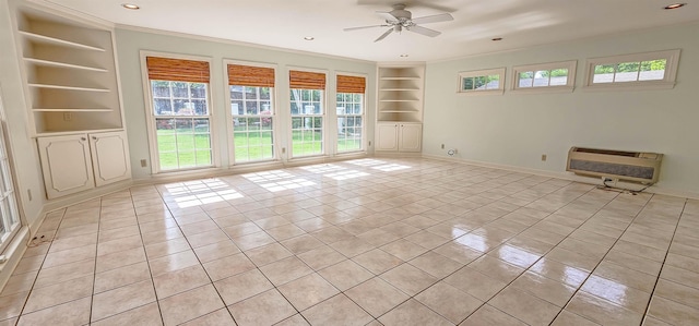 spare room with light tile patterned floors, ceiling fan, heating unit, recessed lighting, and built in features