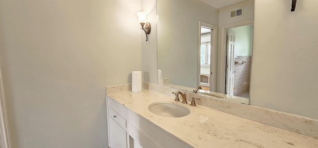 bathroom featuring visible vents and vanity