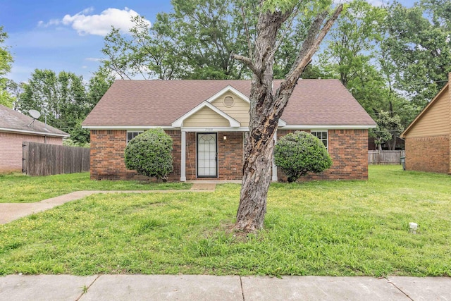 2568 Parkview Dr, Memphis, TN 38128 - ranch-style home featuring a front yard, fence, roof with shingles, and brick siding