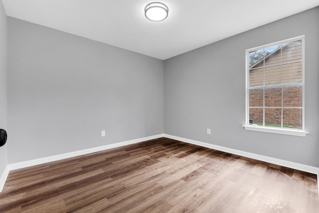 2568 Parkview Dr, Memphis, TN 38128 - unfurnished room with baseboards and dark wood finished floors