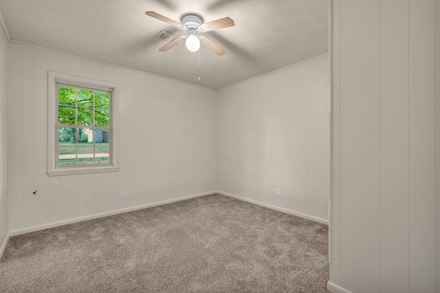empty room with a ceiling fan, carpet flooring, and baseboards