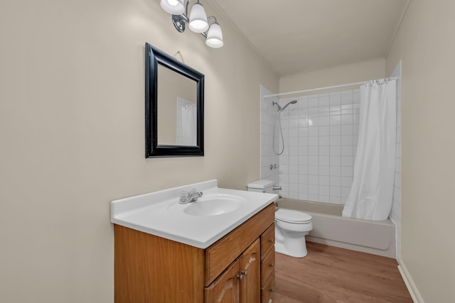 bathroom with wood finished floors, toilet, vanity, shower / tub combo with curtain, and crown molding