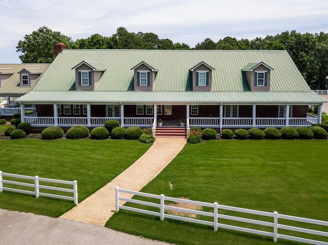 view of front of house featuring a front lawn, a porch, and fence private yard