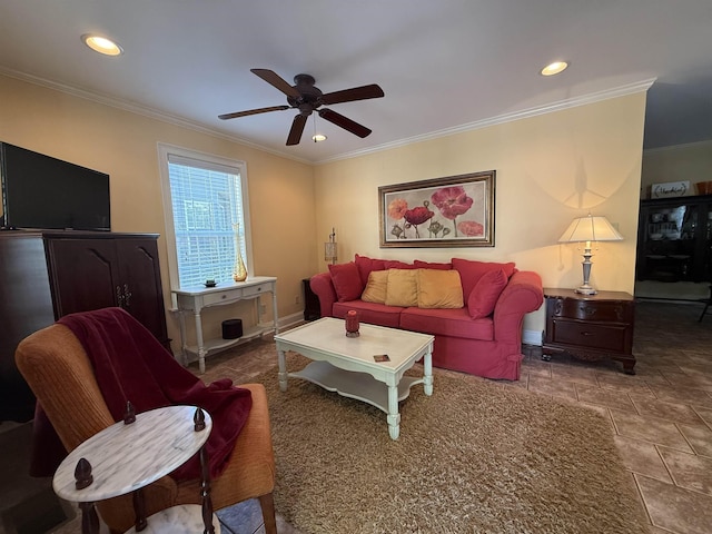 living room featuring baseboards, stone finish flooring, ornamental molding, and ceiling fan