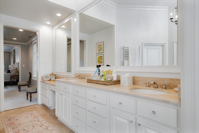 ensuite bathroom featuring recessed lighting, ensuite bath, double vanity, and a sink