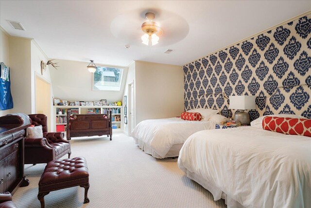 bedroom with visible vents, a ceiling fan, and carpet flooring