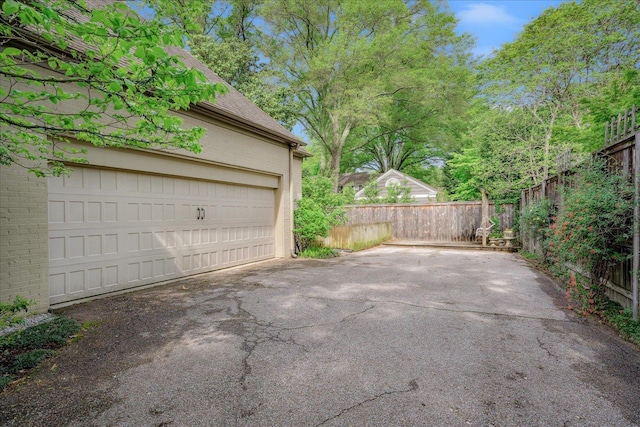garage featuring fence