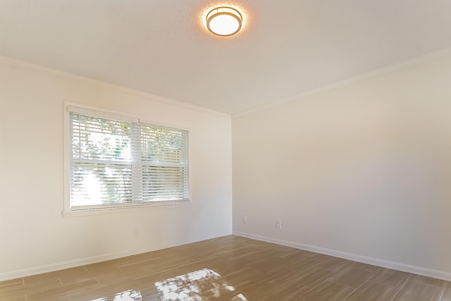 4143 Hilldale Ave, Memphis, TN 38117 - empty room with wood finished floors, crown molding, and baseboards