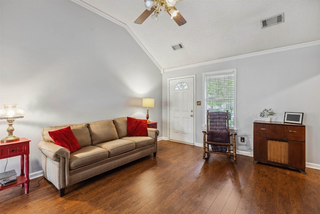 living area featuring crown molding, a ceiling fan, visible vents, and vaulted ceiling
